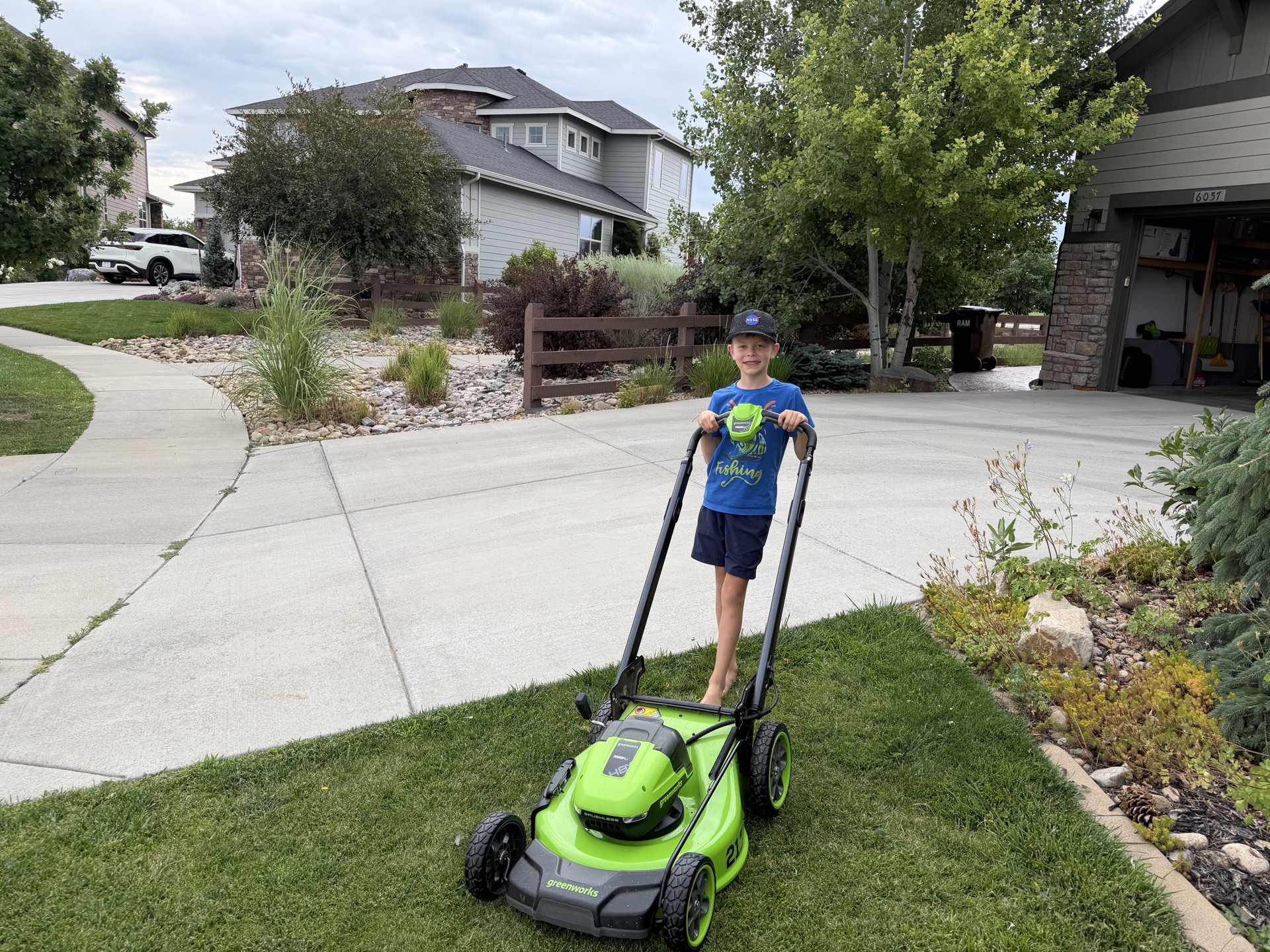 Bromley mowing a lawn in Kechter Farm